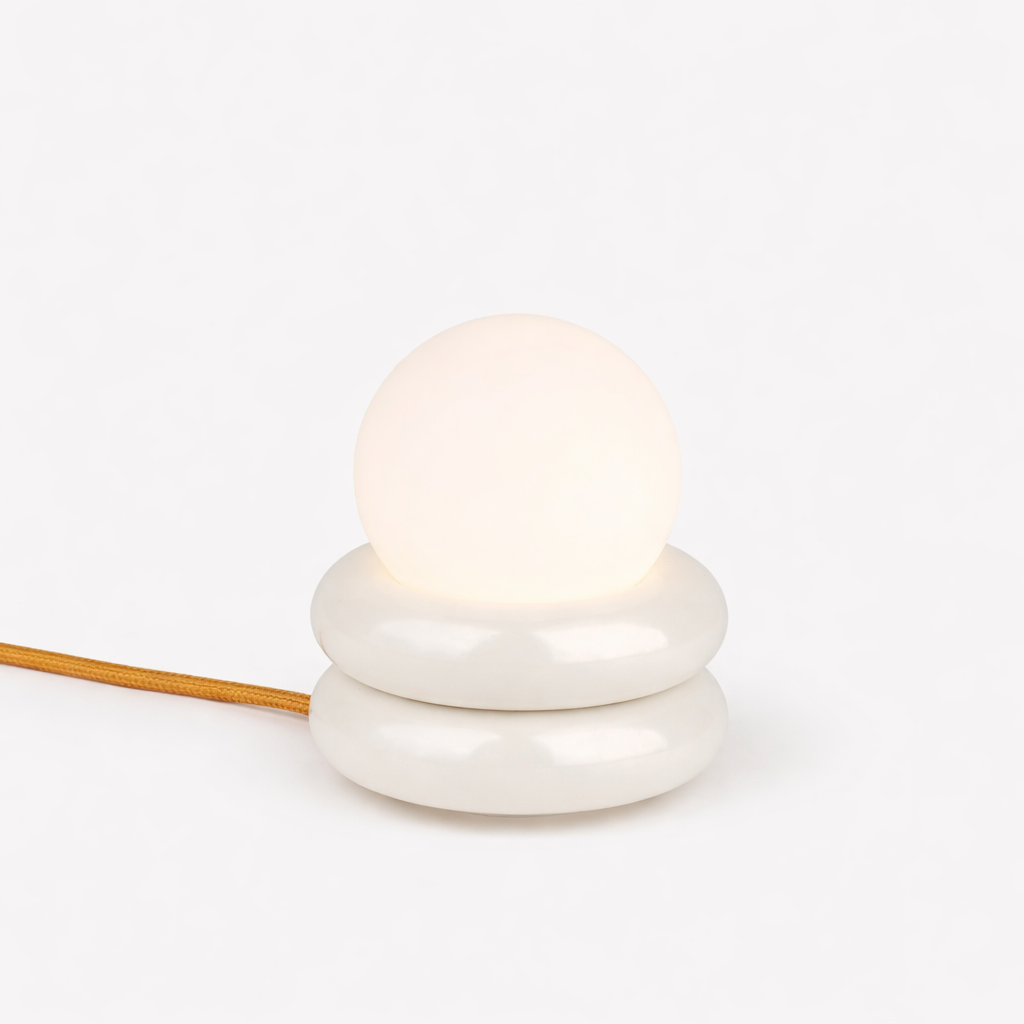 HAHA Studio Donut lamp in powder coated aluminum with stacked geometric silhouette handmade Sweden Dear Johny. Compact architectural lamp designed and crafted in Stockholm for versatile wall or table use.