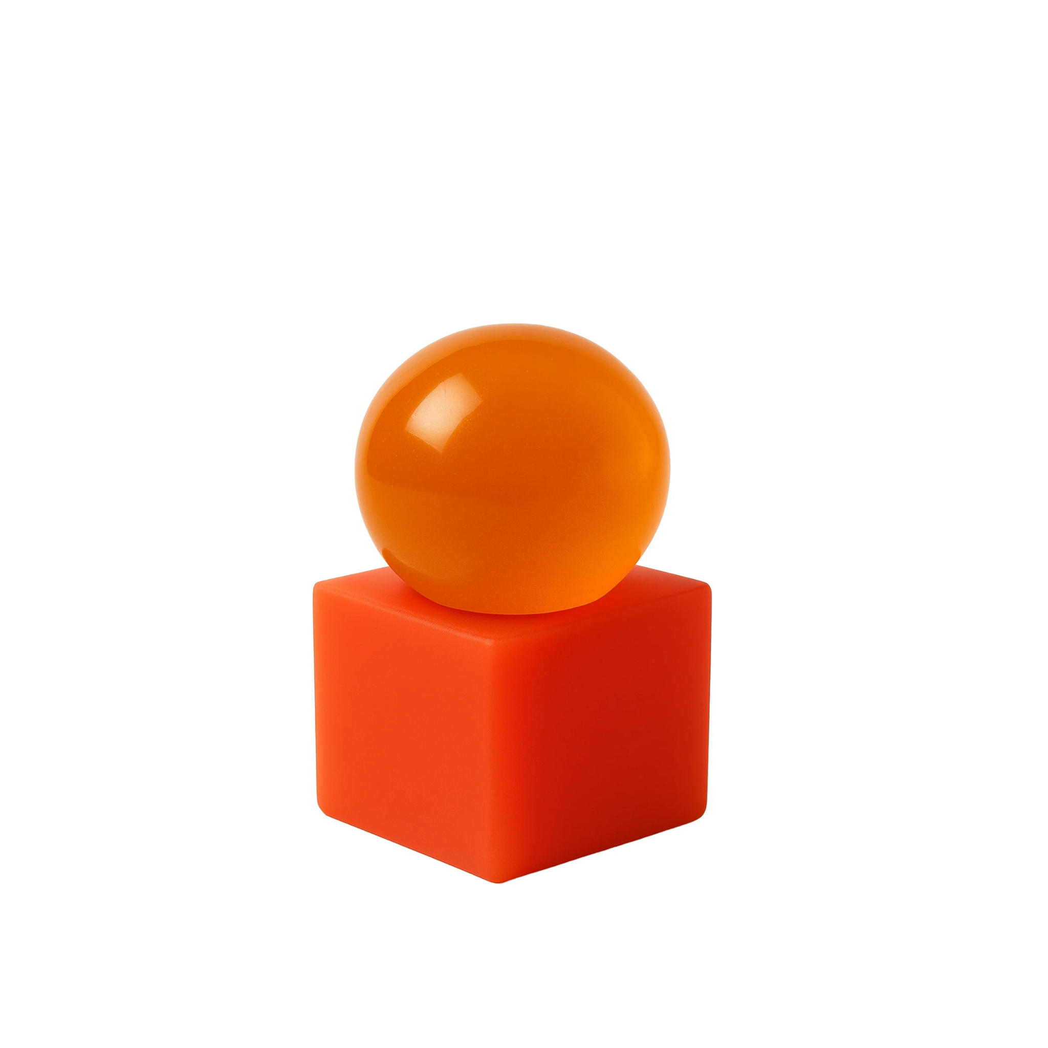Matias Moellenbach OBA Papaya soap with translucent orange sphere on a coral resin base.