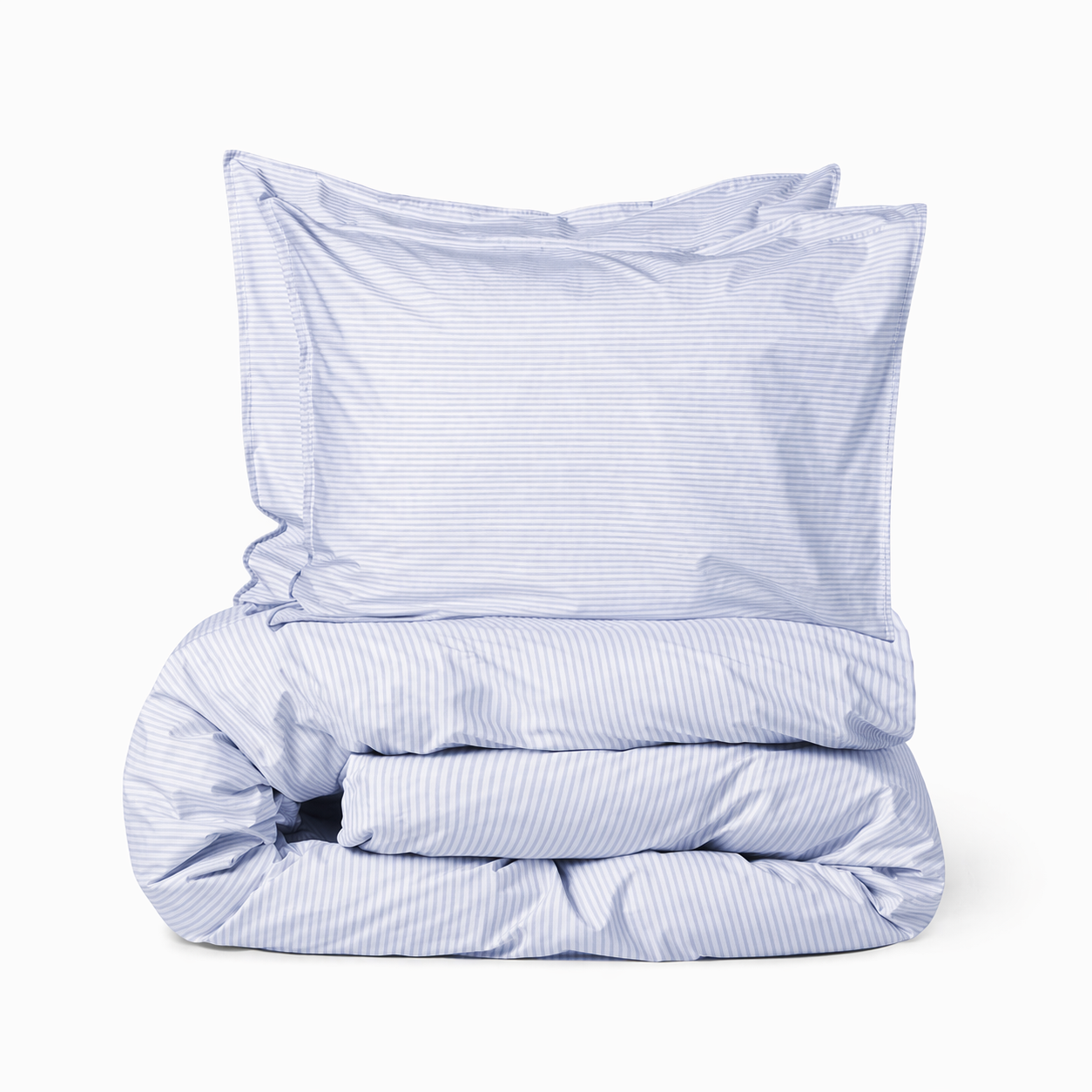 Striped bedding set by SUITE702 in blue and ecru, made from organic percale cotton.