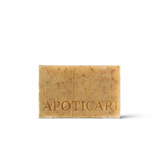 Handmade Apoticari Nettle Face Soap on a stone surface, showcasing the artisanal cold-process texture and botanical French pharmacy heritage.