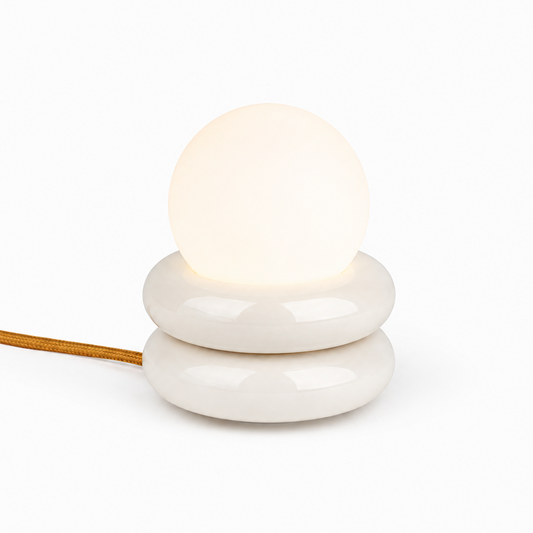 HAHA Studio Donut lamp in powder coated aluminum with stacked geometric silhouette handmade Sweden Dear Johny. Compact architectural lamp designed and crafted in Stockholm for versatile wall or table use.