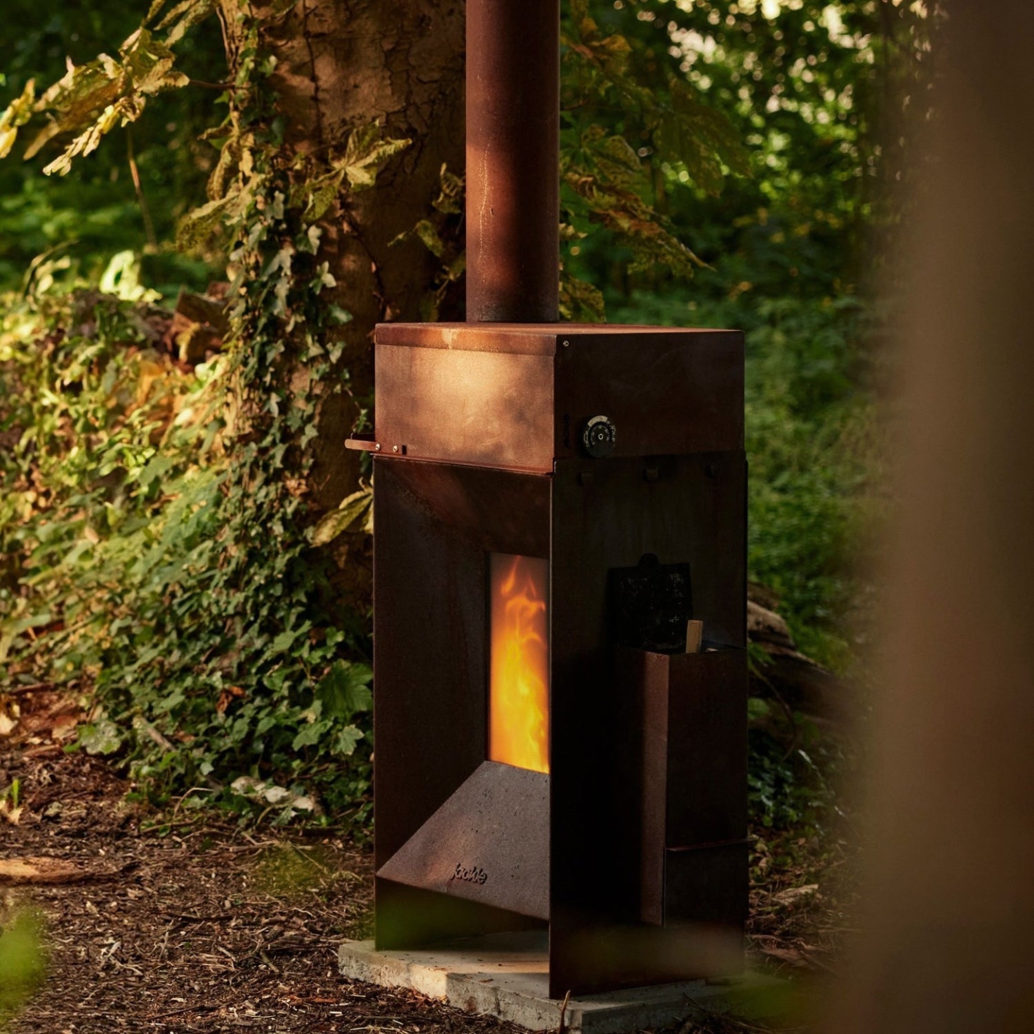 Jackie ecological outdoor stove in Corten steel by Bram circular design low CO emission sustainable patio heater with pizza oven option Dear Johny