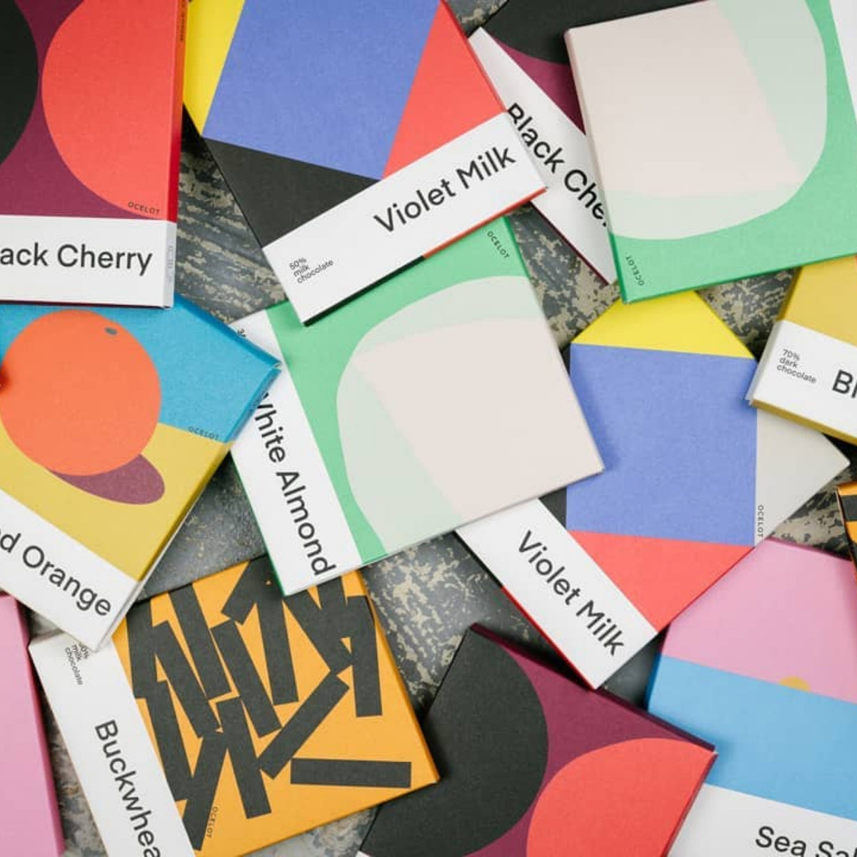 Handcrafted organic dark chocolate bars in artistic graphic packaging by Ocelot