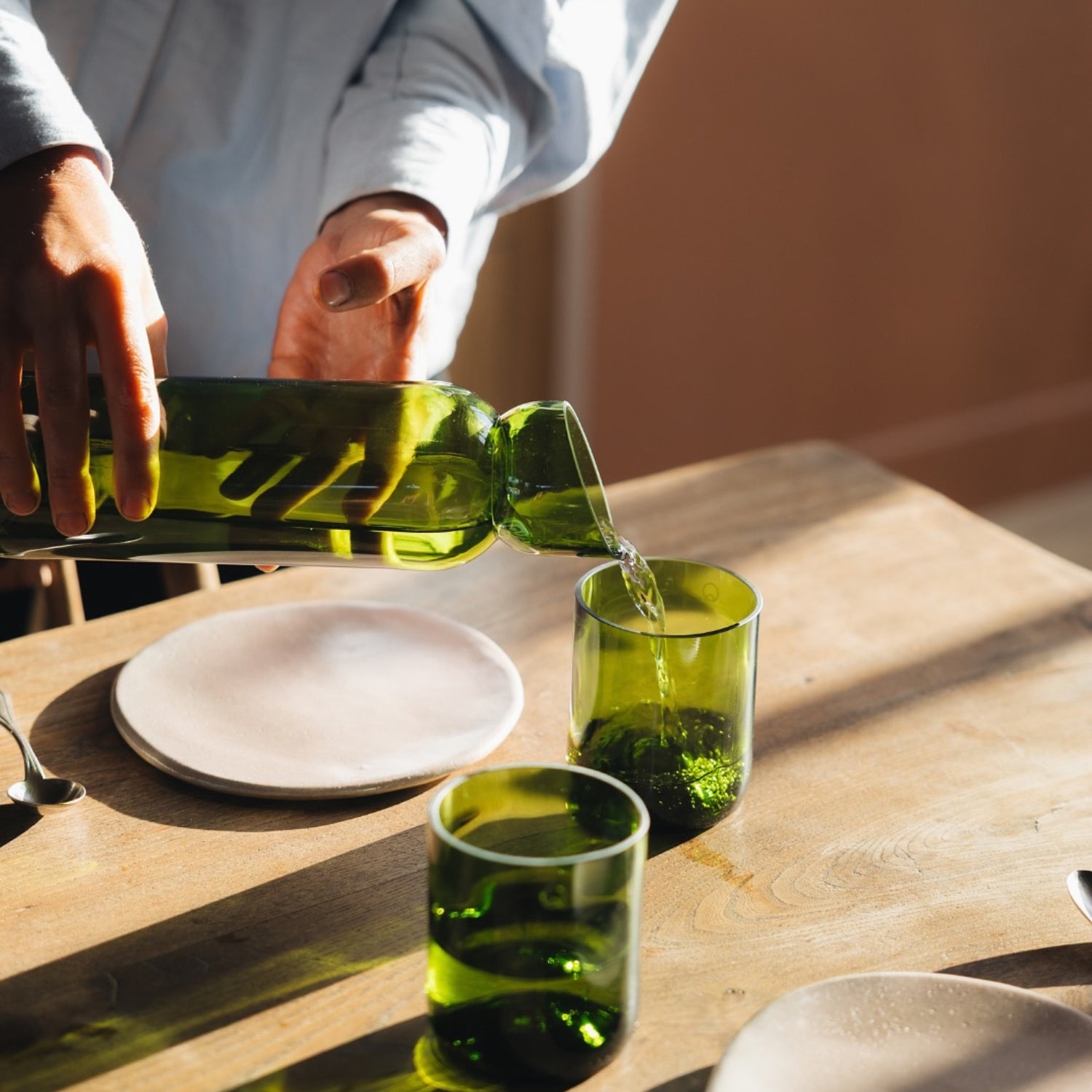 Handcrafted upcycled glass tableware, carafes, and home decor objects by QDB Editions